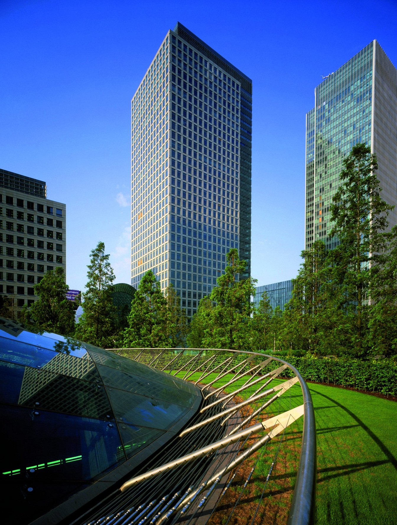 Modern glass office building against blue sky representing corporate law